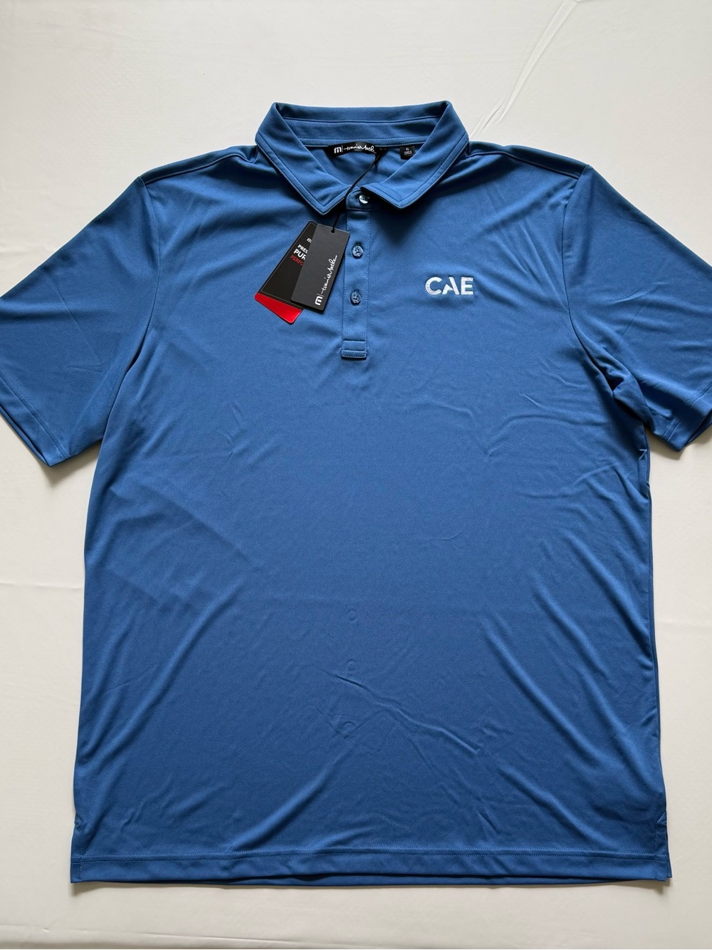 NWT TravisMathew Coto Performance Golf Polo Shirt Mens XL Federal Blue CAE Logo